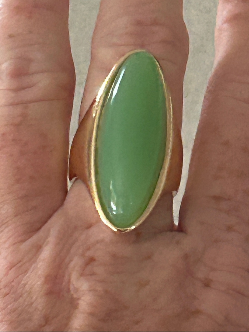 Gold-Tone Ring with Green Oval Stone